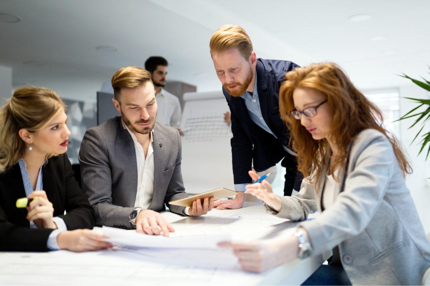 business-people-working-together-on-project-and-B3MZ4TX-min